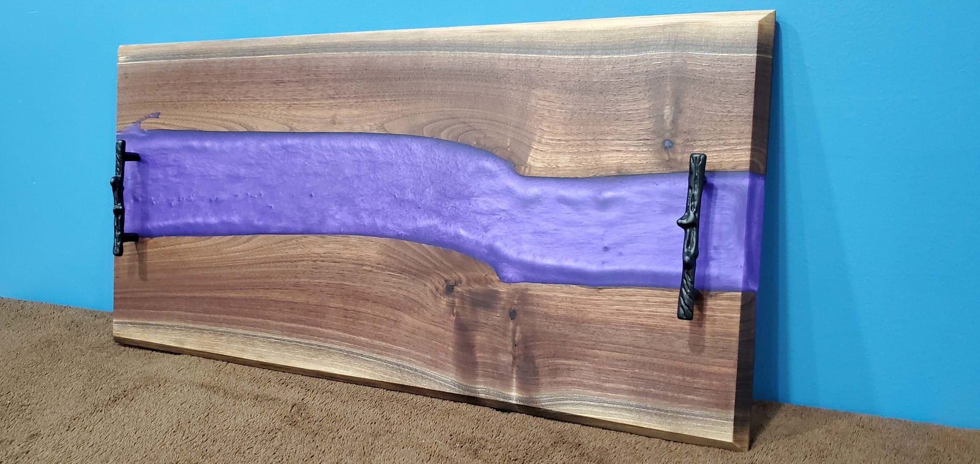 black faux tree handles on purple river charcuterie board