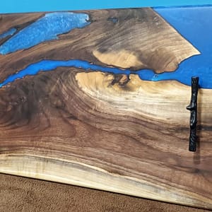 side profile of blue epoxy river board