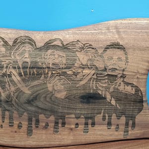 oiled cutting board with villain portraits