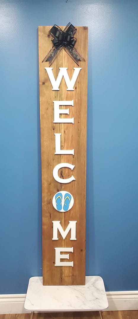 vertical welcome sign with blue sandals