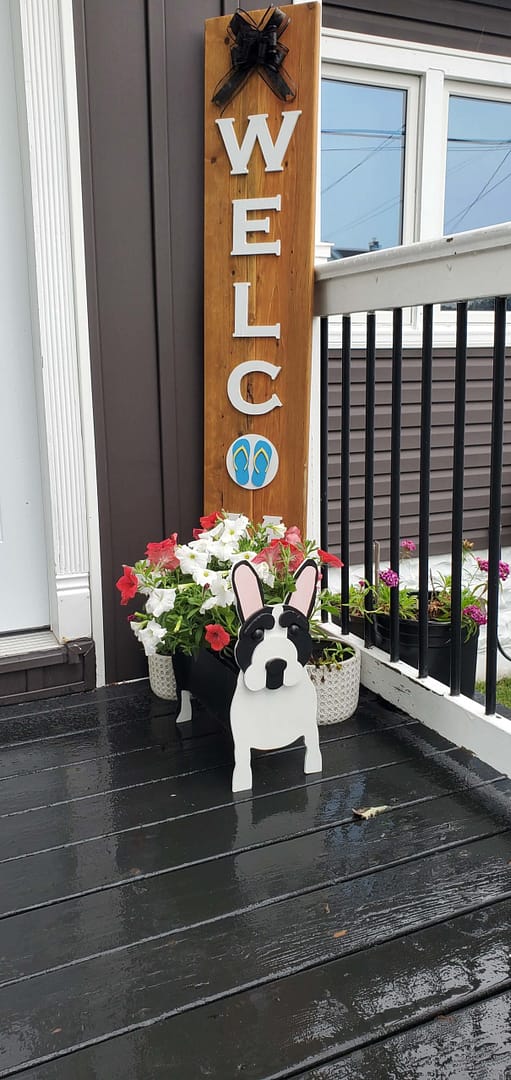 welcome sign outdoors with flowers