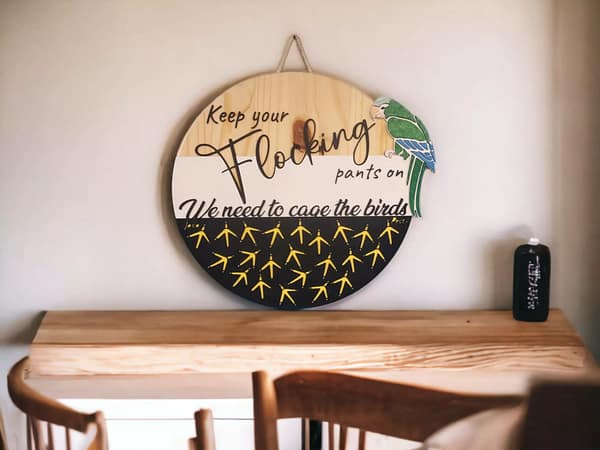 parrot sign on kitchen table