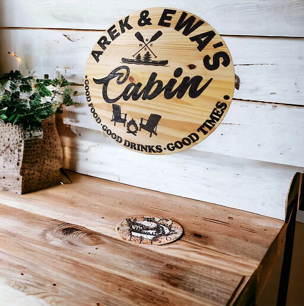 round wood cabin sign on white wall